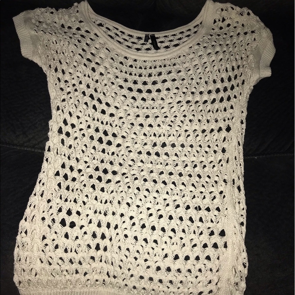 Woman’s cream colored shirt